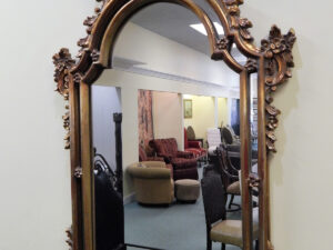 An Antique Mirror with Metal Frames Image