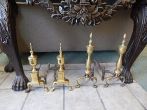 Pair of Brass Andirons on the Floor Image