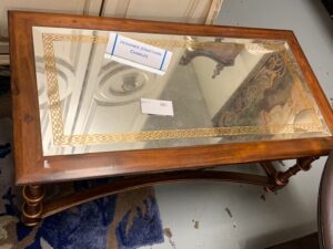 A Wooden Table with Mirror on Top Image