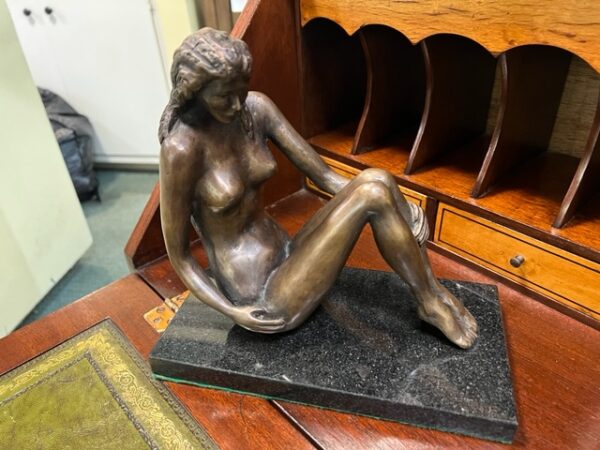 A Nude Bronze Figure on the Table Image