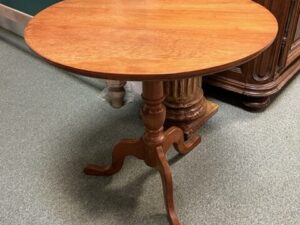 A Round Center Table with Tri Stand Image