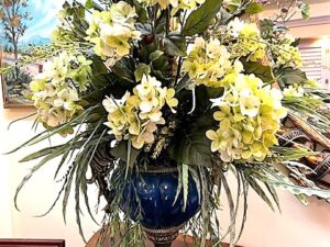 floral arrangement in blue vase