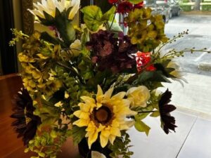 Floral Arrangement in a Black Metal Vase Image