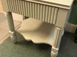 A White Wooden Furniture on a Carpet Image