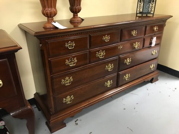 A Wooden Furniture with Multiple Cupboards Image