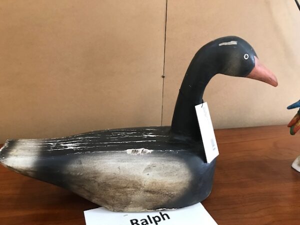 A Black and White Shaped Duck on the Table Image