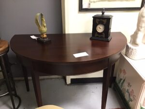 A Watch and a Porcelain Item on the Table