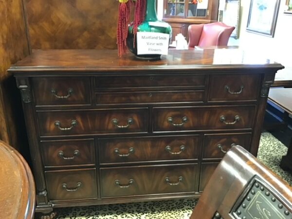 A Wooden Table with Multiple Cupboards Image